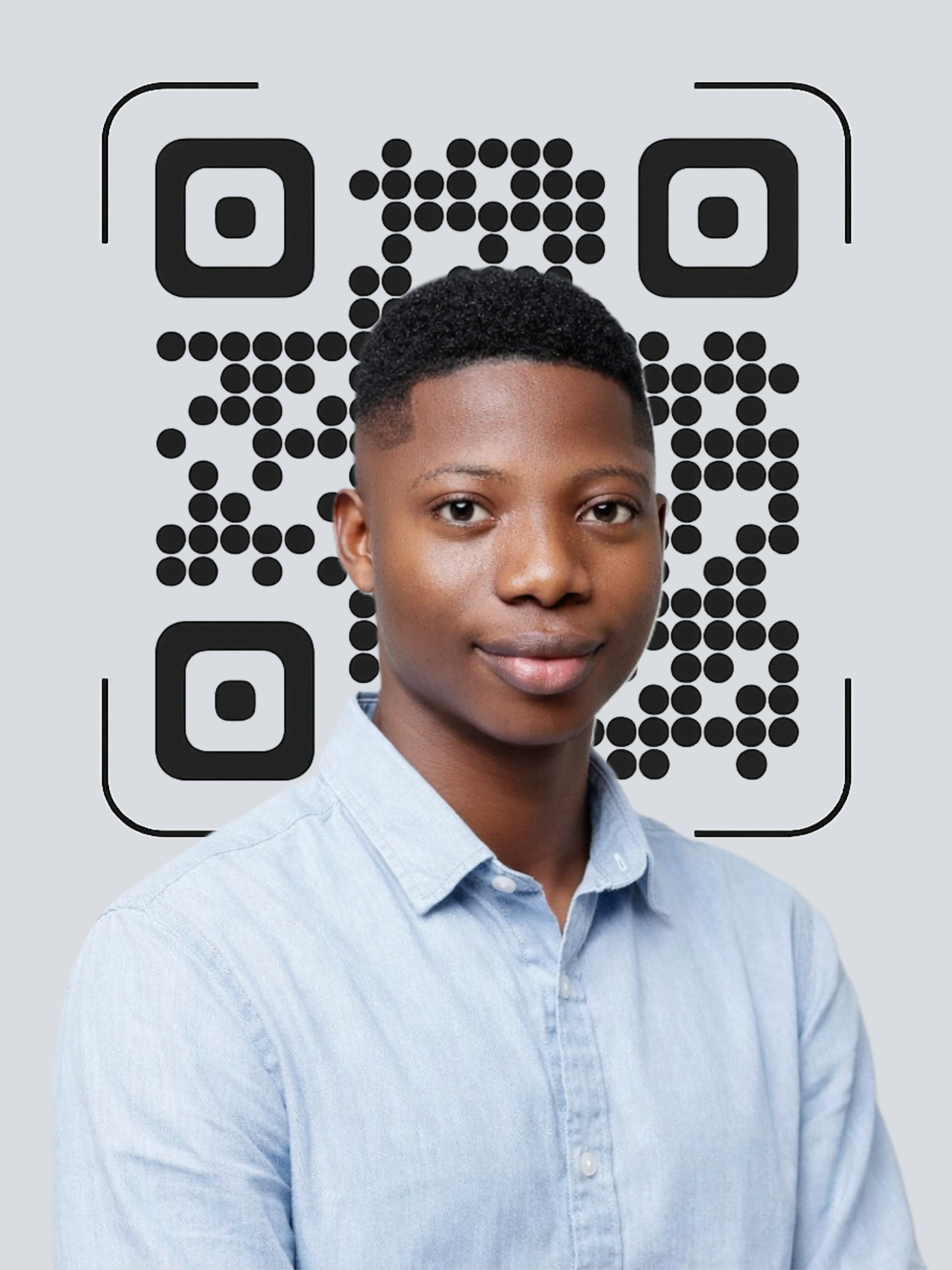 Portrait of a man wearing glasses and a light blue shirt, smiling slightly.